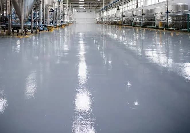 Seamless floor in a beverage production plant